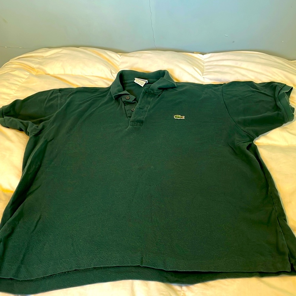 Lacoste polo in hunter green. Size 7. Measures 23 in pit to pit. 26 in in length